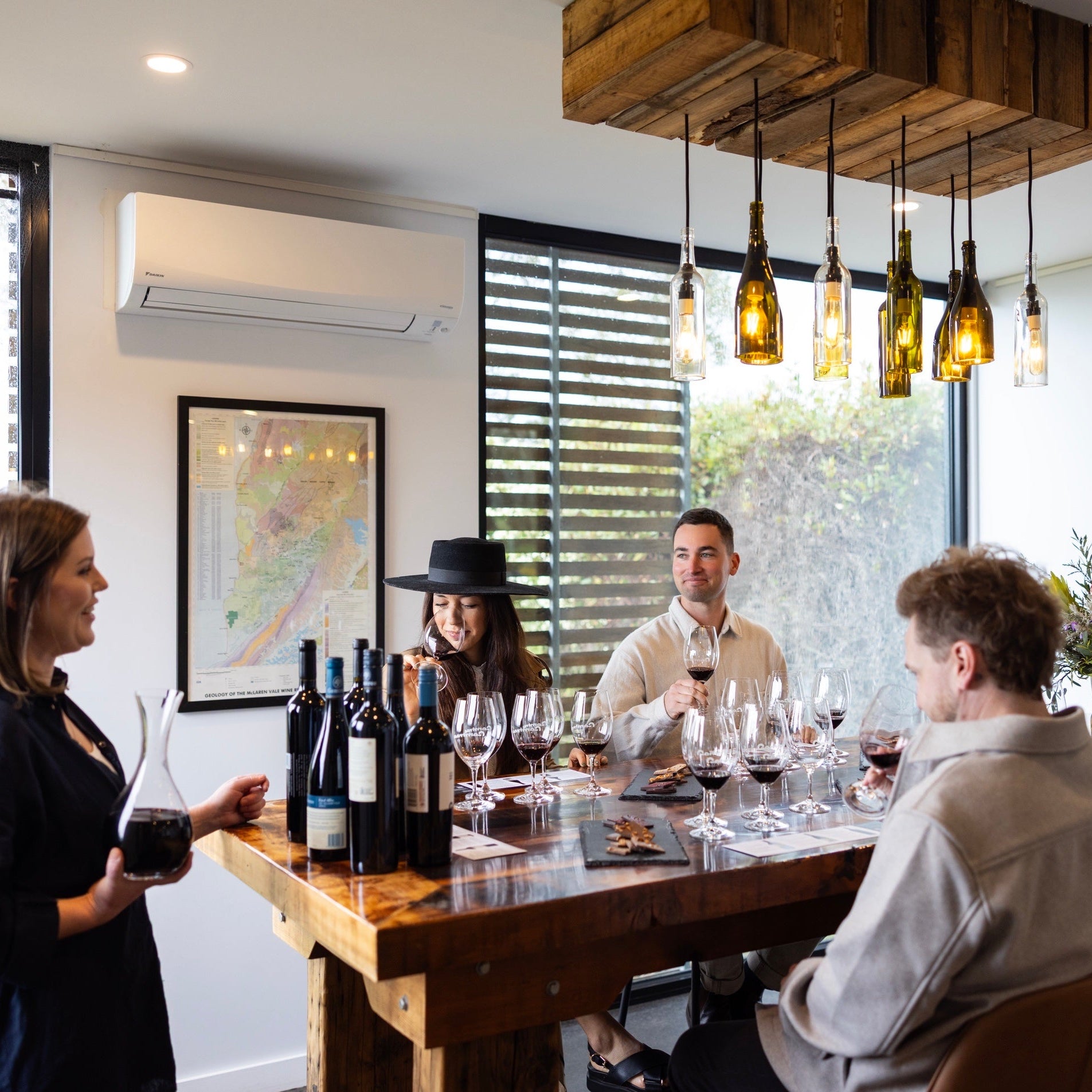 Group of people gathered at Gemtree Wines tasting wines during guided masterclass.